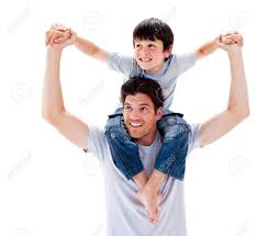 Close-up Of Father Giving His Son Piggyback Ride Stock Photo ...